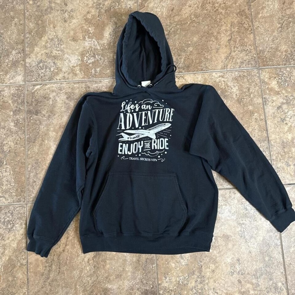 This stylish fleece-back hoodie features a unique travel-inspired design